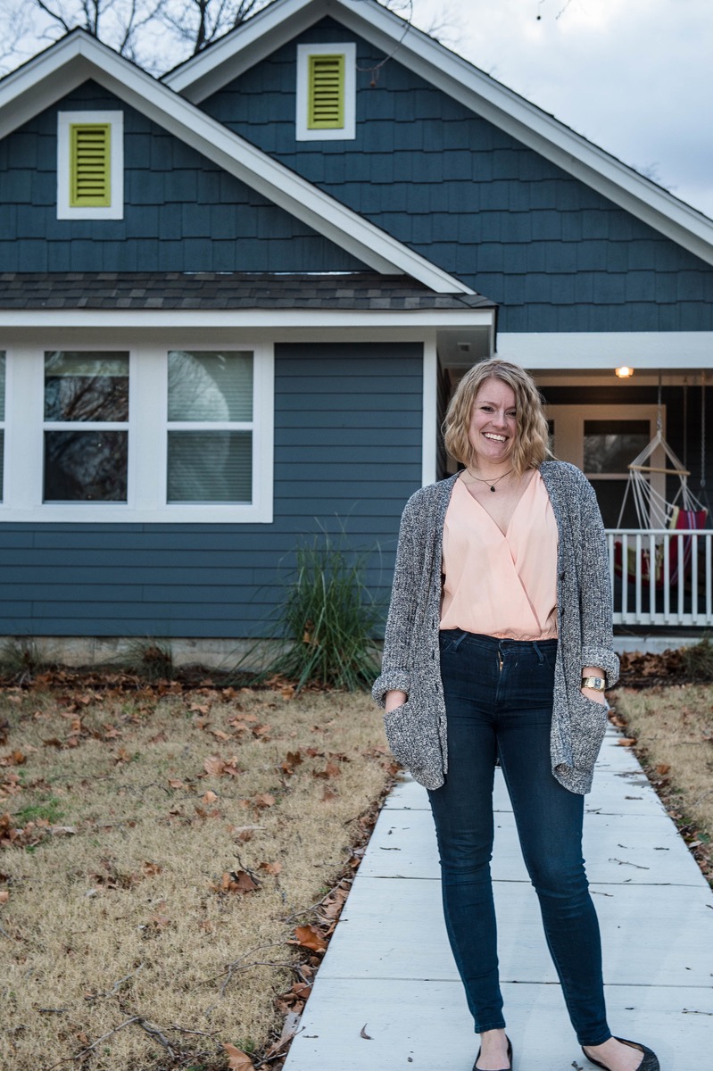 Valerie Wiegman standing in front of her home built by Postively Paseo foundation in the Classen Ten Penn district of Oklahoma City. – Version 2