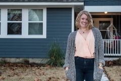 Valerie Wiegman standing in front of her home built by Postively Paseo foundation in the Classen Ten Penn district of Oklahoma City. – Version 2